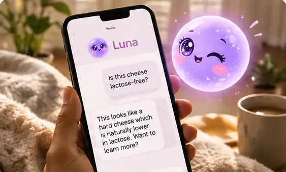 A phone showing a chat with Luna asking whether a cheese is lactose-free, with Luna winking